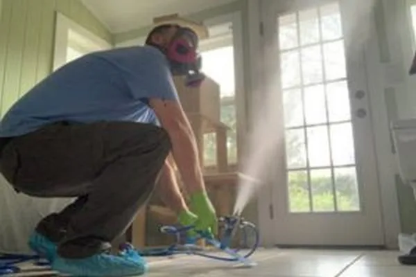 Man performing dry fogging treatment inside a home in Florida