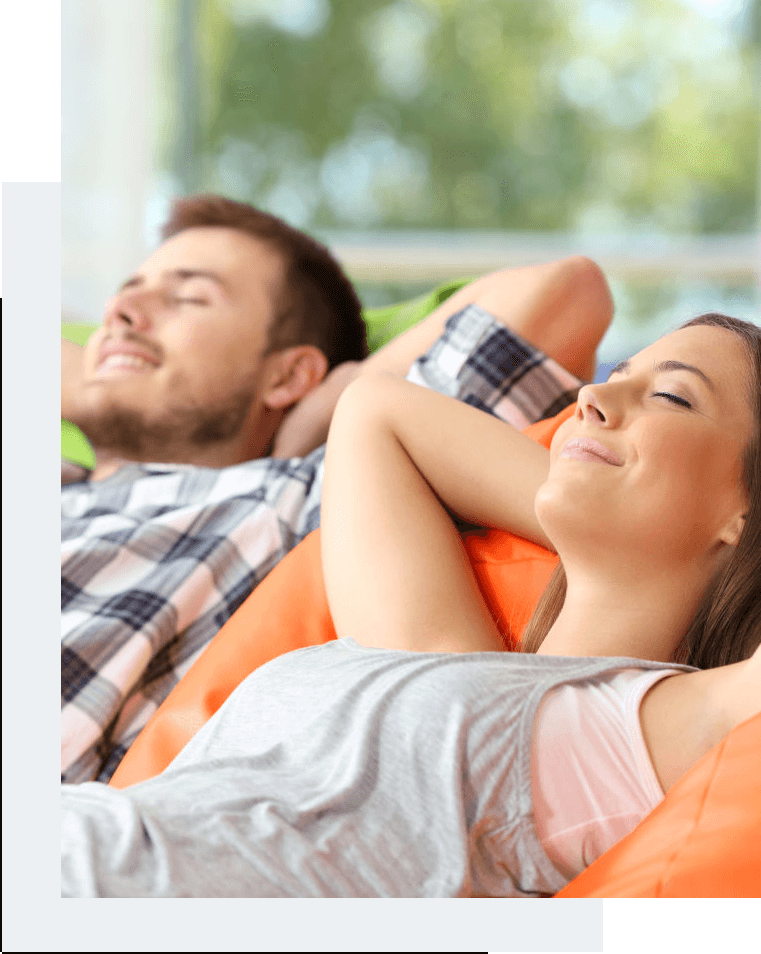 A picture of a man and a woman relaxing on a chair, breathing a clean and pure air